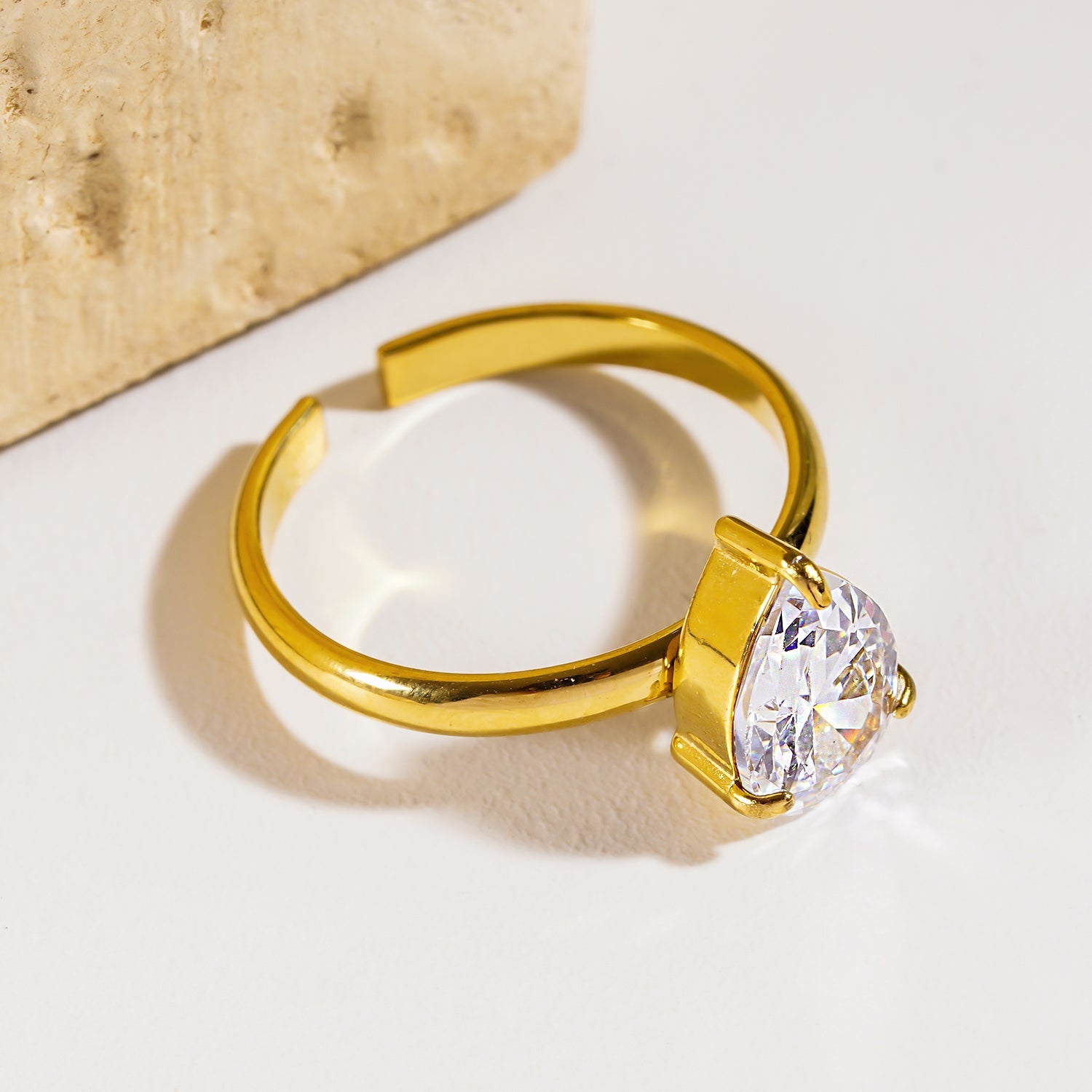 DIMONDA: Classic Gold Ring with Prominent Teardrop Zirconia Centerpiece
