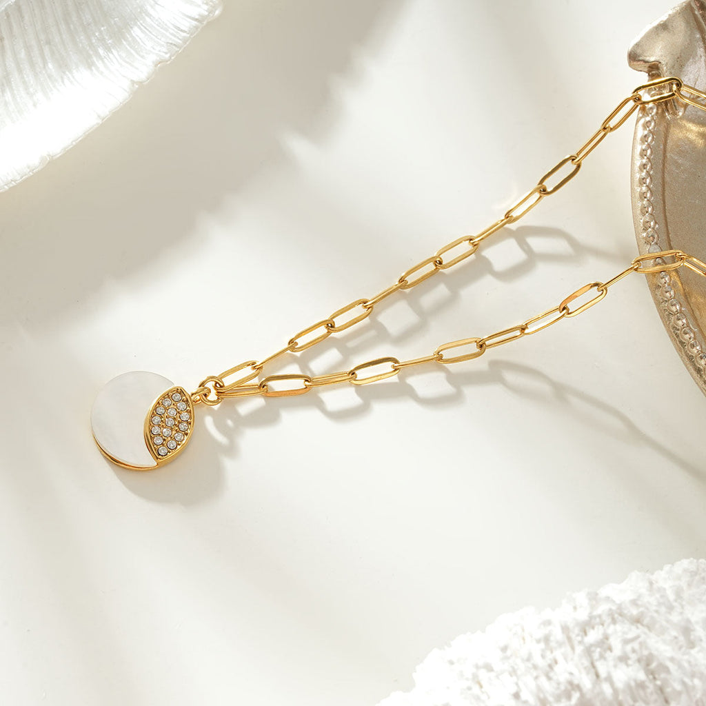 MOGGNA Gold: Coastal Shell Charm Necklace with Oval-Cut Zirconia Inlay