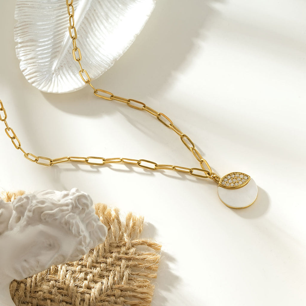 MOGGNA Gold: Coastal Shell Charm Necklace with Oval-Cut Zirconia Inlay