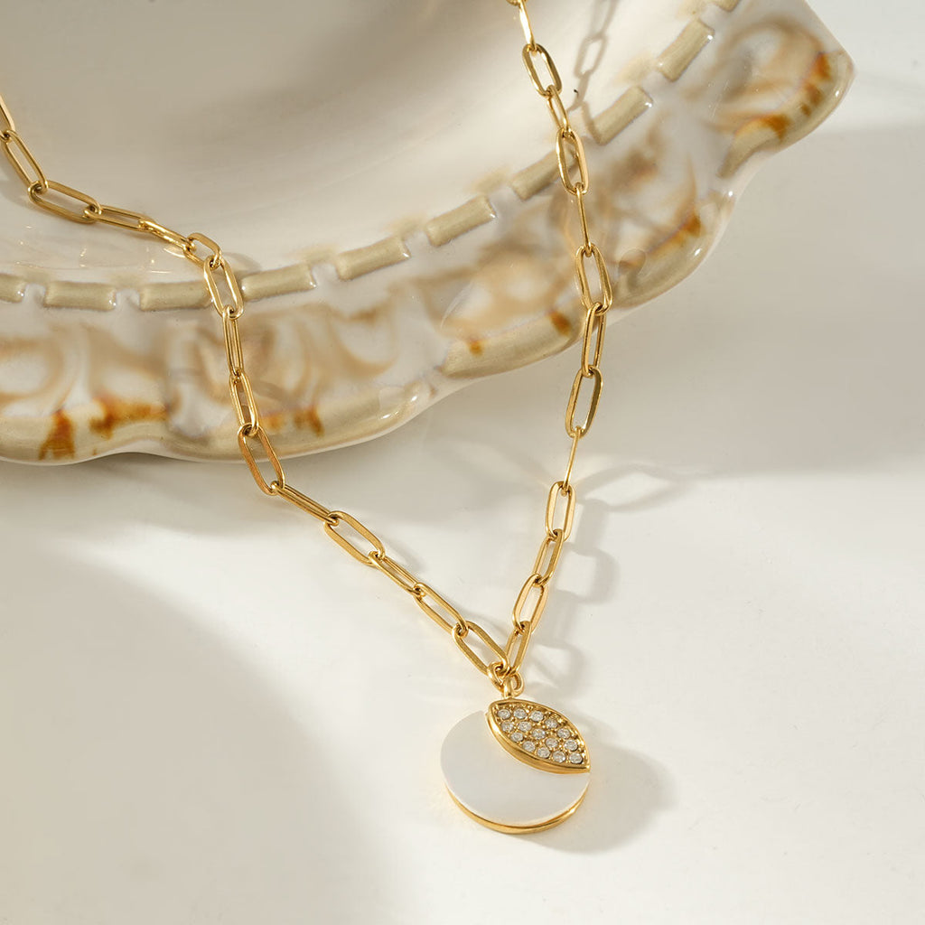MOGGNA Gold: Coastal Shell Charm Necklace with Oval-Cut Zirconia Inlay