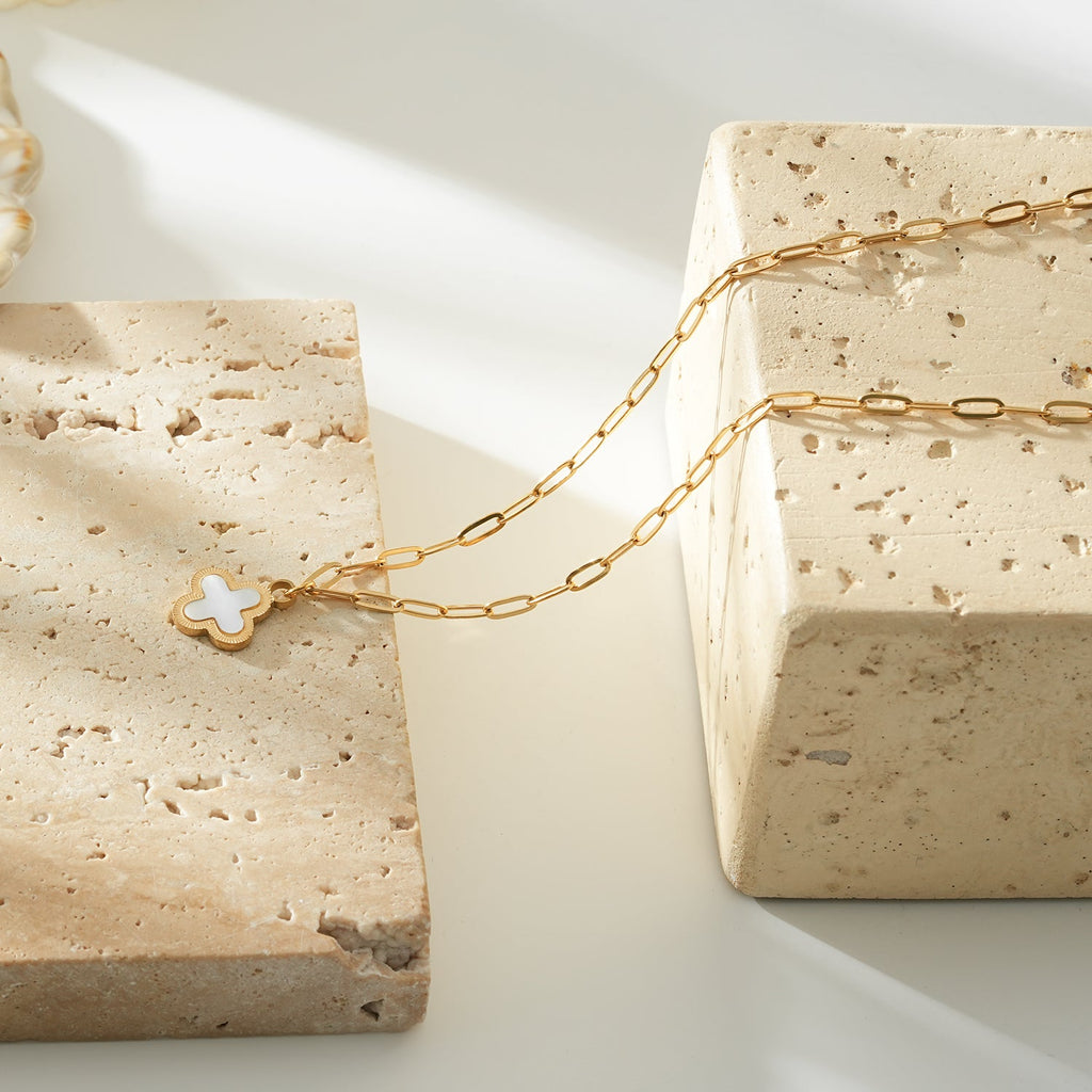 MAKA Gold: Clover Shaped Charm in Natural Shell & Gold Metal Border on a Paperclip Chain
