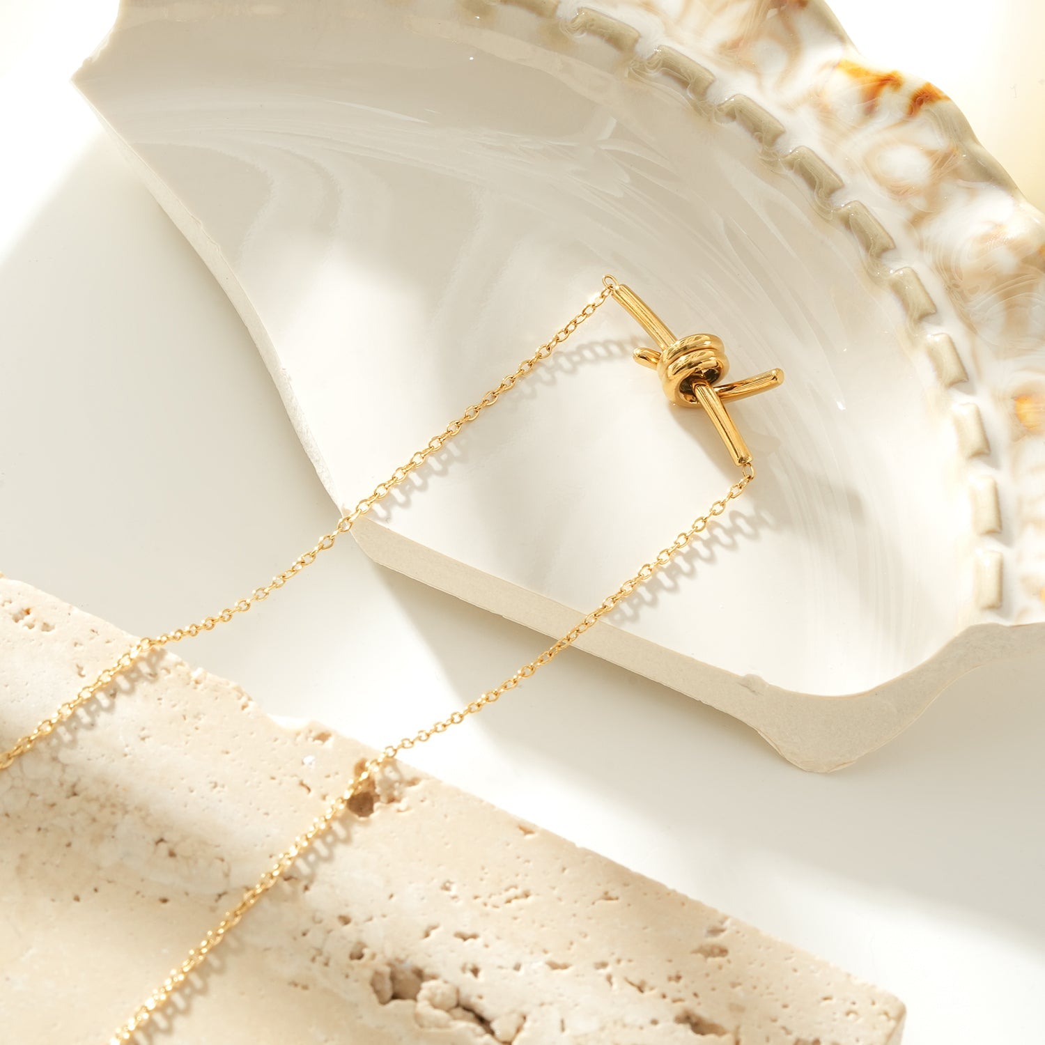 LARISA Gold: Bar Pendant Necklace with Knotted Symbol Detail