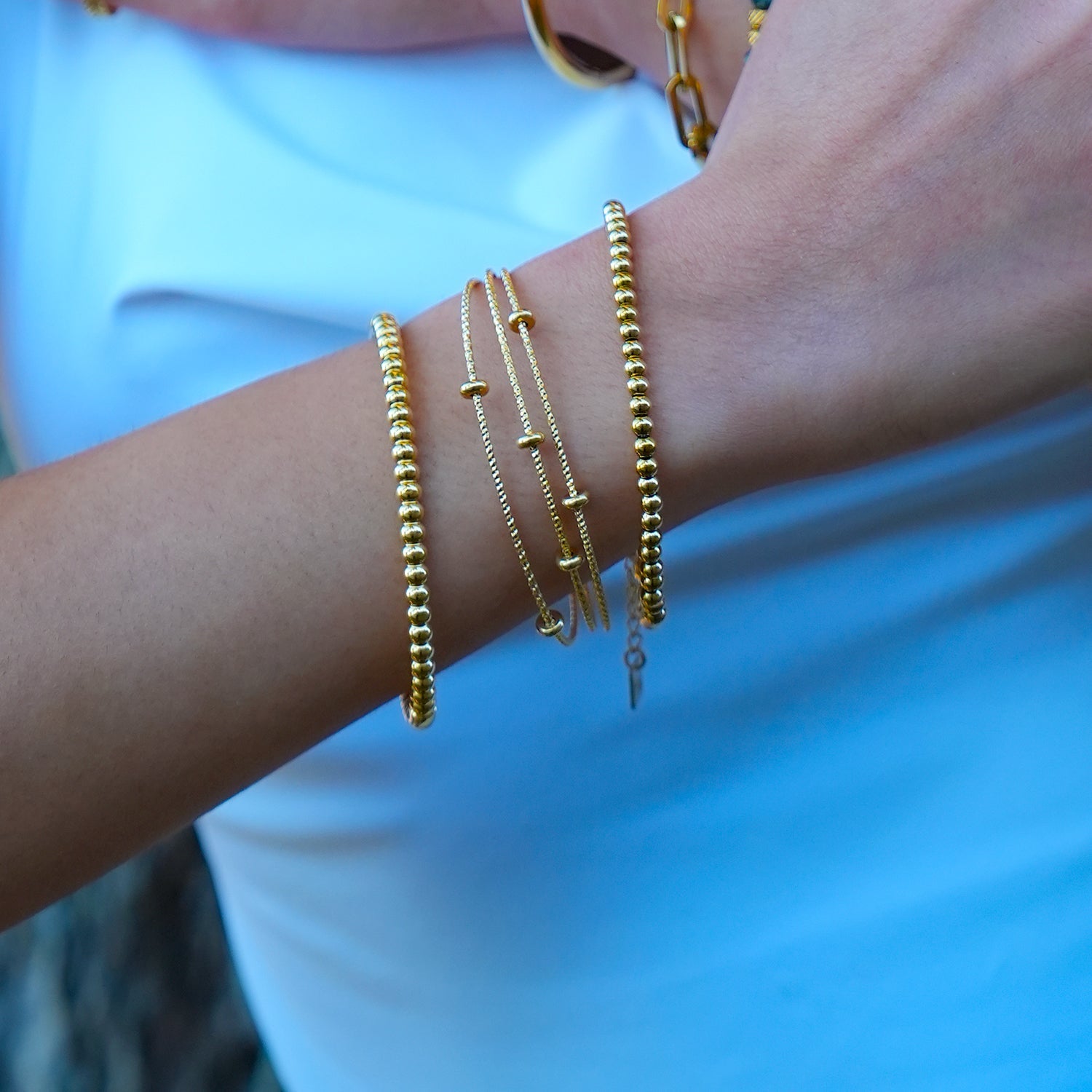Style FARZIKA Gold: Triple Stacked Textured Beaded Bracelet