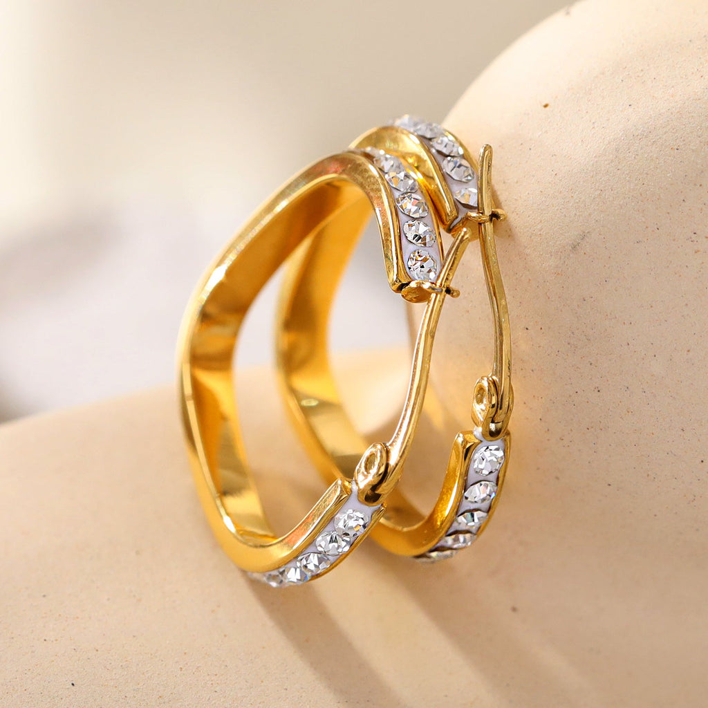 Style MELFI Gold: Abstract Heart Shaped Hoops embedded with Zirconia Gemstones