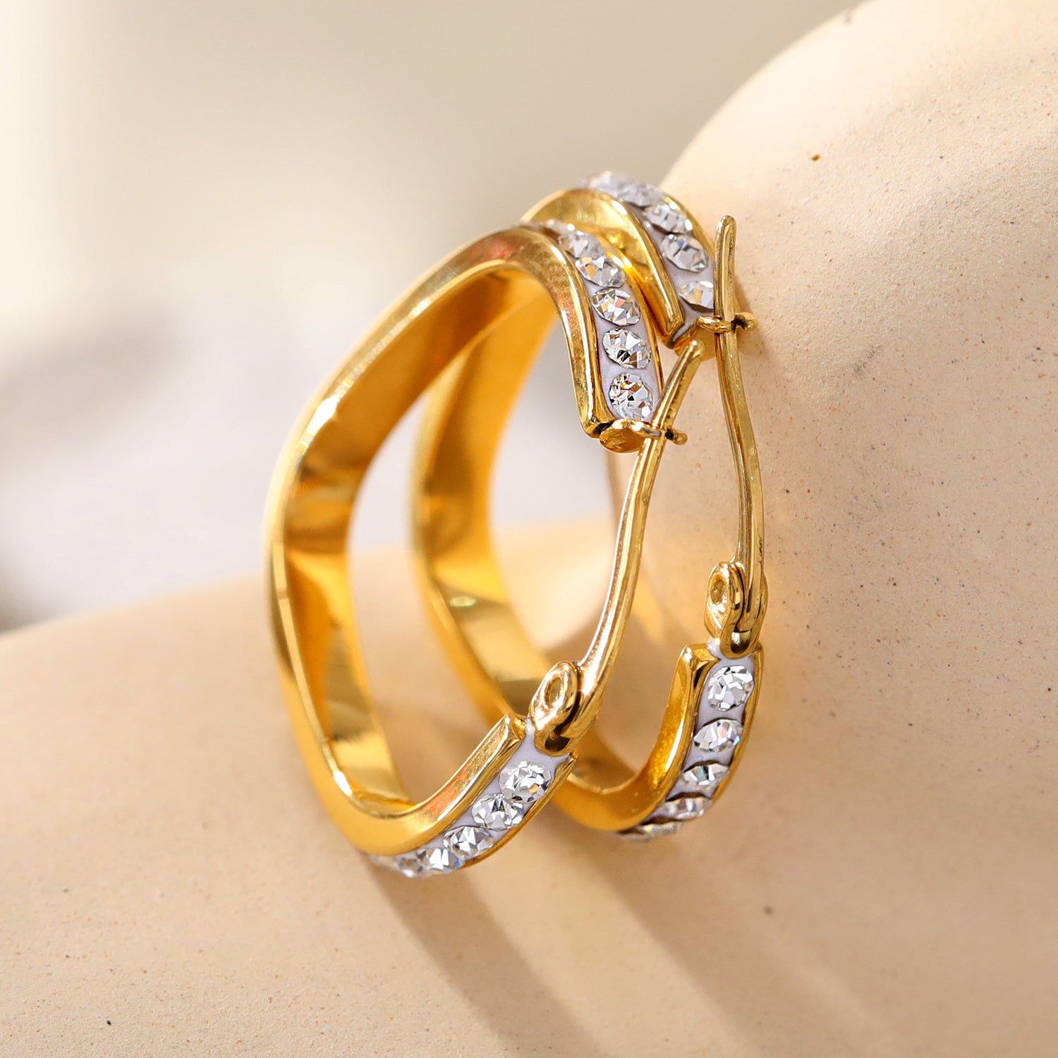 Style MELFI Gold: Abstract Heart Shaped Hoops embedded with Zirconia Gemstones