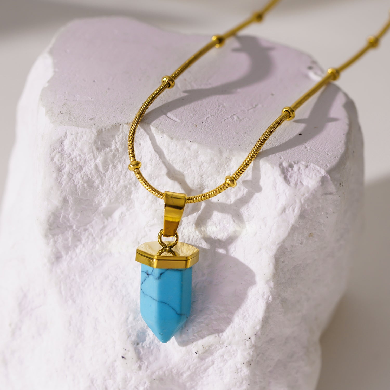 PIPPA: African Turquoise Stone Pendant Anchored on a Beaded Snake Skin Textured Chain Necklace